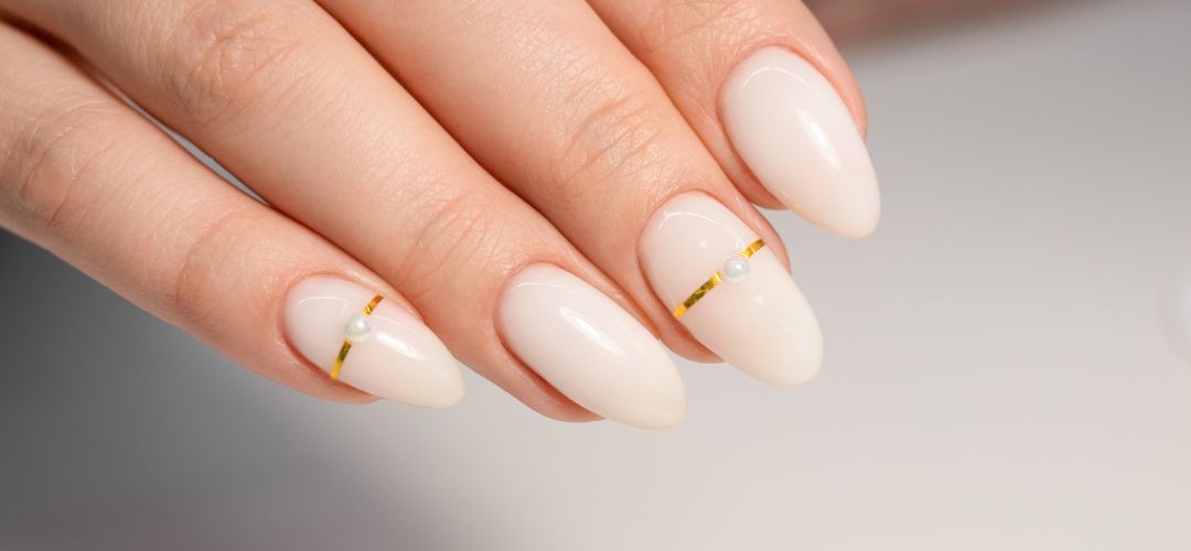 Milky white nails with gold