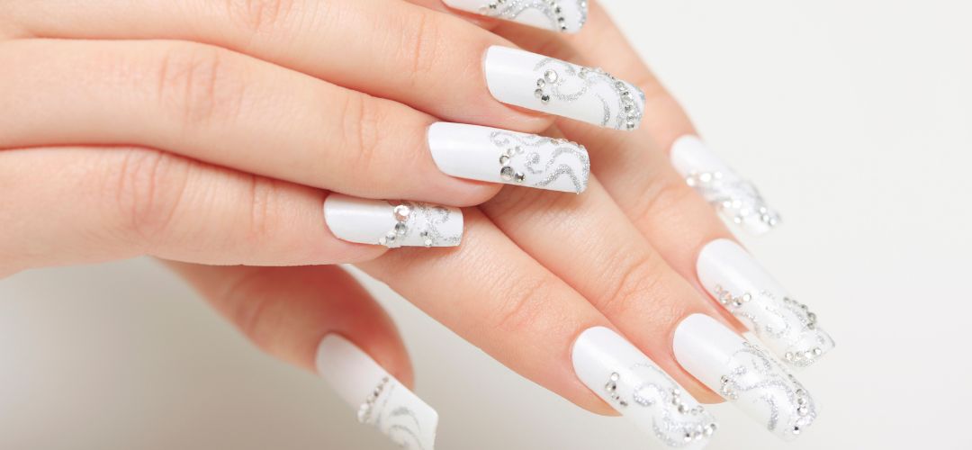 Milky white nails with rhinestones